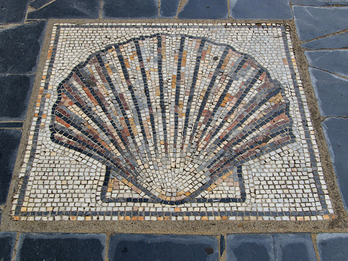 Scallop shell marking the way in Sarria, Galicia, Spain