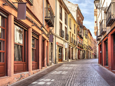 Narrow pedestrian street in the center of Leon,  León, Castile and León, Spain